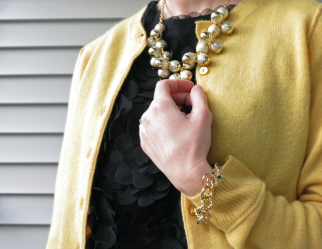 yellow cashmere cardigan, skinny black pants, cobalt pumps, colorblock bag, cluster pearl necklace