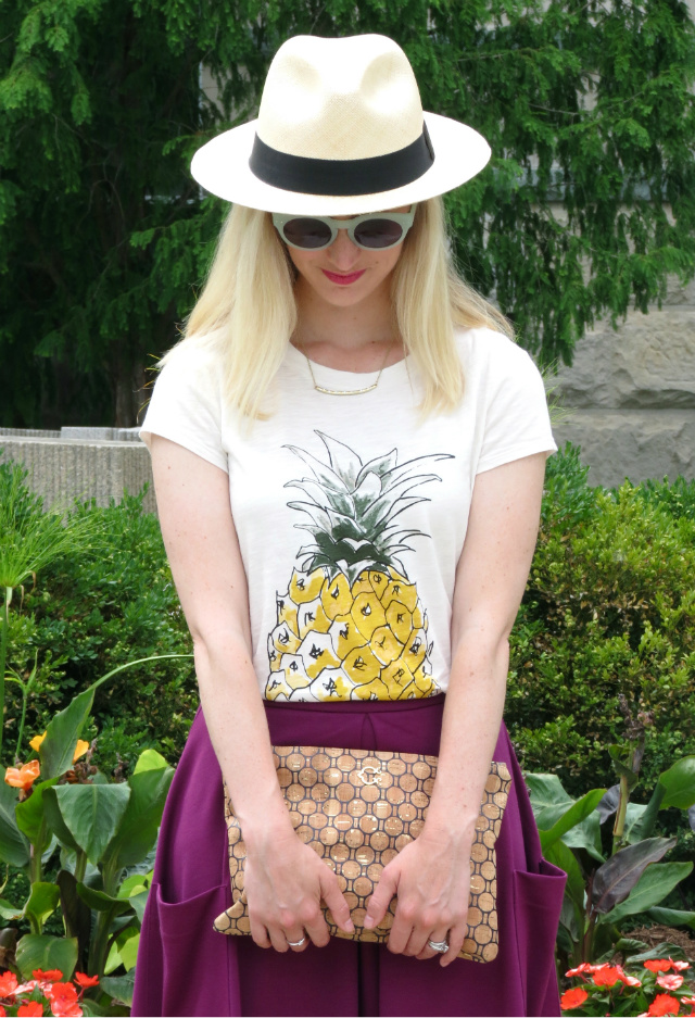 cork clutch, ann taylor pineapple tee, asos midi skirt, j crew panama hat