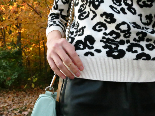 snow leopard sweater, faux leather skirt, shooties, statement necklace