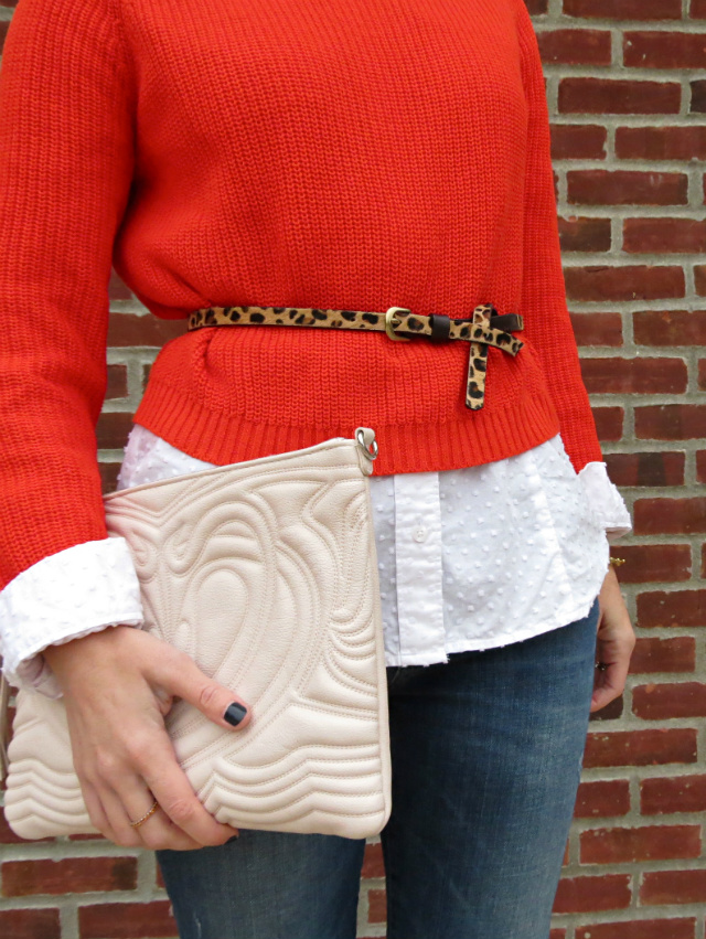 cropped sweater over white shirt, leopard belt, cutout ankle boots, blush oversized clutch
