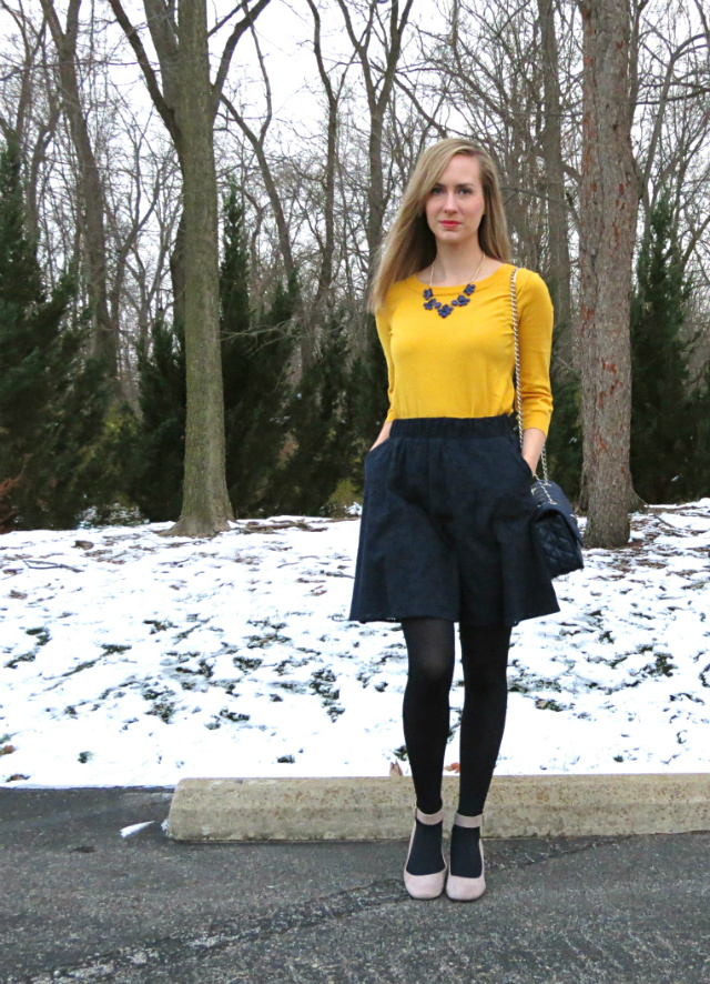 yellow sweater, leather pleated midi skirt, slouchy boots, statement necklace, navy quilted bag, red satchel, cashmere