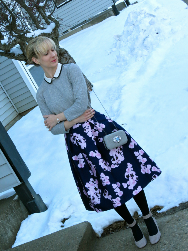 floral midi skirt, peter pan collar sweater, ankle strap low heels, bangs, jeweled clutch, audrey hepburn style