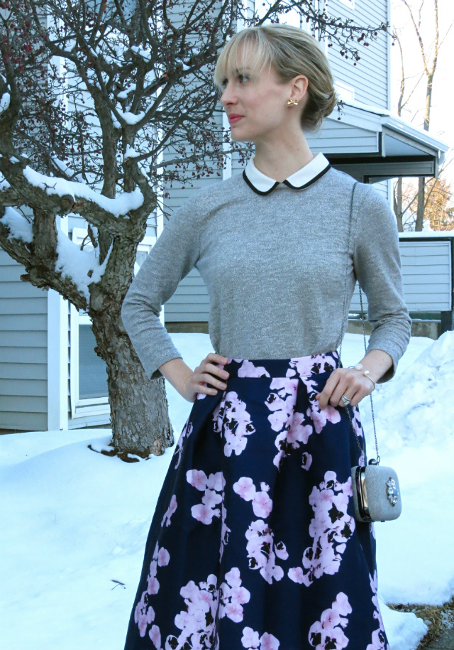 floral midi skirt, peter pan collar sweater, ankle strap low heels, bangs, jeweled clutch, audrey hepburn style