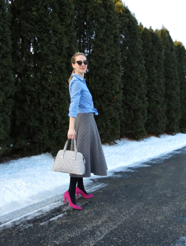 joa quilted midi skirt, knotted gingham shirt, double pearl earrings, pink suede pumps, perforated gray satchel