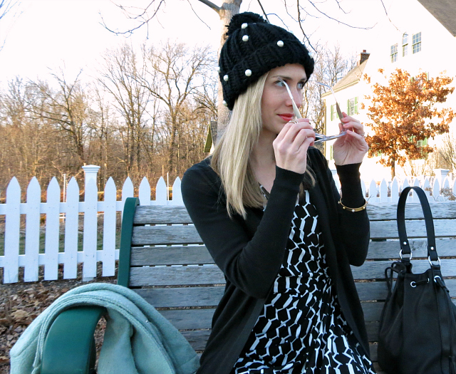black and white wrap dress, mint coat, black pom pom beanie, clear sunglasses, ankle boots with dress, m loves m copycat