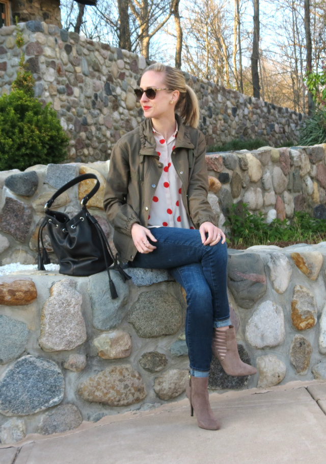 red polka dot blouse, cutout ankle boots, army jacket, bucket bag