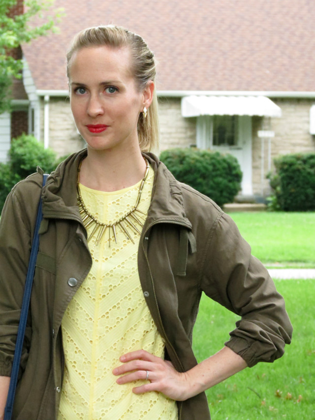 yellow eyelet dress, army jacket, navy bucket bag, ring stack outfit