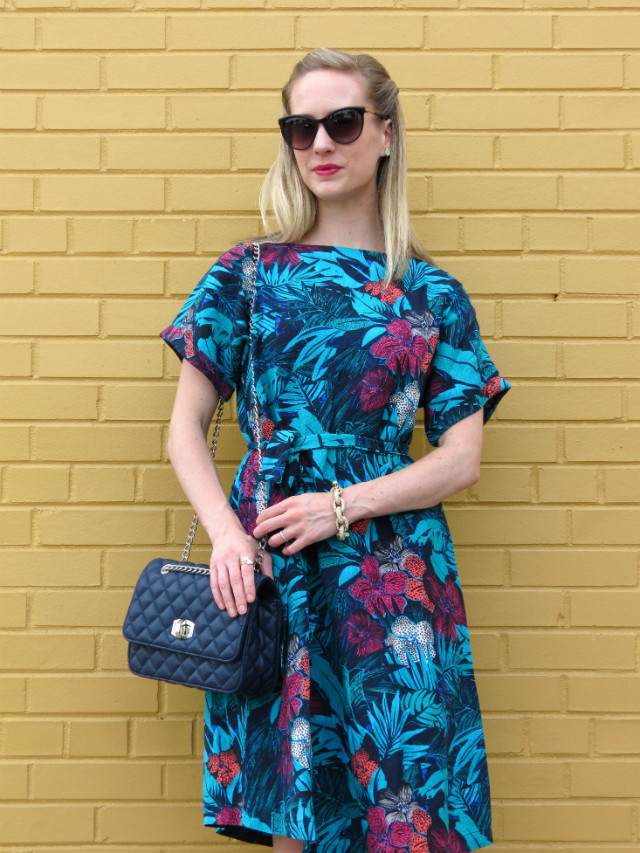 floral midi dress outfit, navy heels and bag, cateye sunglasses