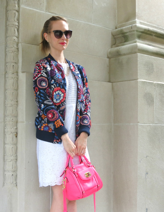 floral bomber jacket, white dress, cobalt suede heels, hot pink bag