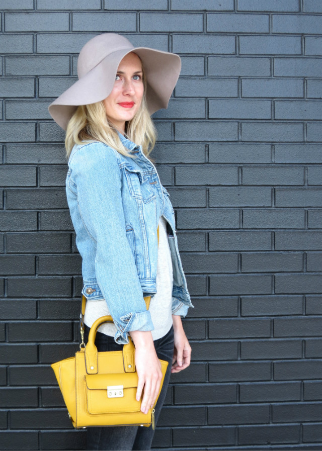 floppy fall hat, distressed faded black skinny jeans, mustard yellow bag