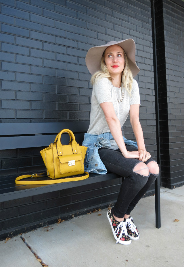 floppy fall hat, distressed faded black skinny jeans, mustard yellow bag