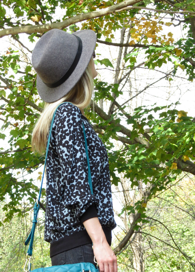 J. Crew wool hat, blue leopard top, black distressed skinny jeans