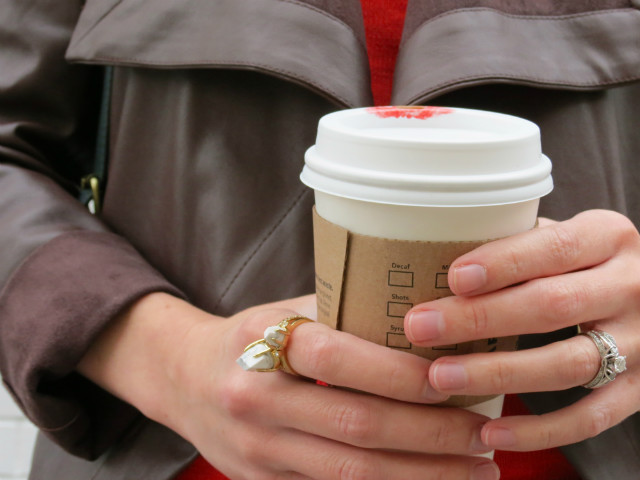 black distressed skinny jeans, haircalf speckled flats, orange sweater, brown leather jacket