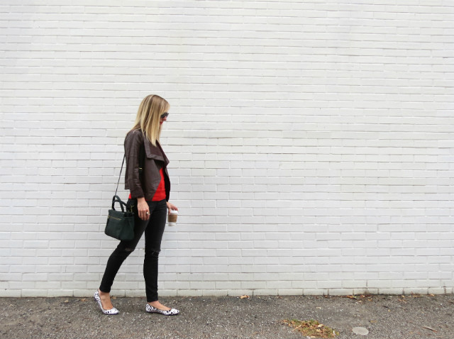 black distressed skinny jeans, haircalf speckled flats, orange sweater, brown leather jacket