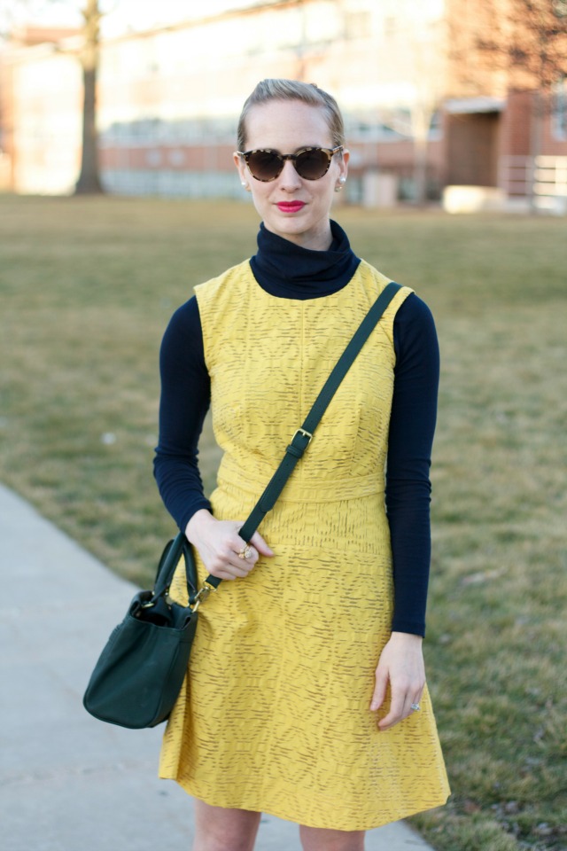 turtleneck layered under dress, gold flats