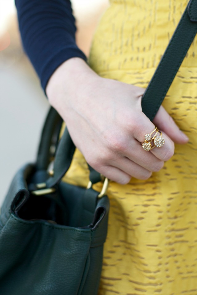 turtleneck layered under dress, gold flats