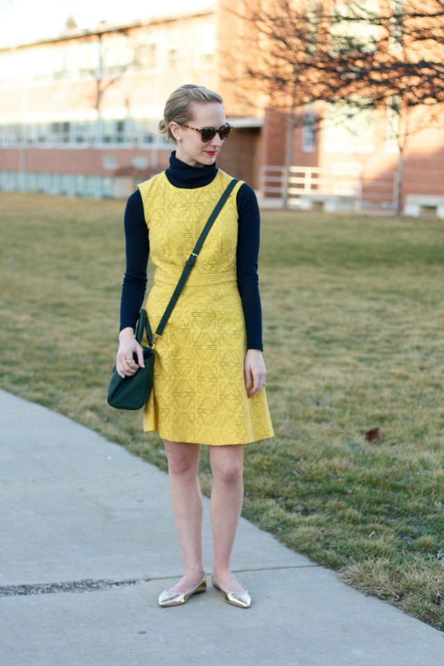 turtleneck layered under dress, gold flats