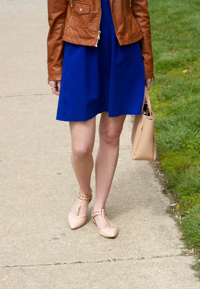 fit and flare dress with tan faux leather moto jacket, studded flats