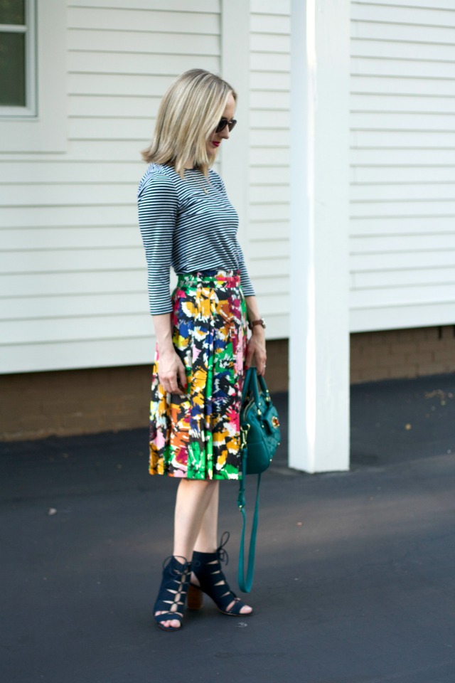 striped tee, abstract floral pleated skirt, Madewell sunglasses, peep-toe booties
