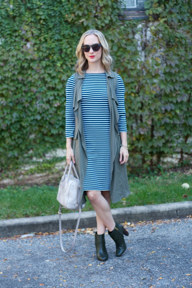 stripe dress, long line olive vest, olive ankle boots, gray Fossil bag