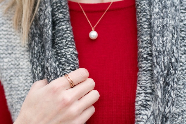 sweater vest, red sweater, matching shoes, coated jeans, pearl pendant, rose gold jewelry