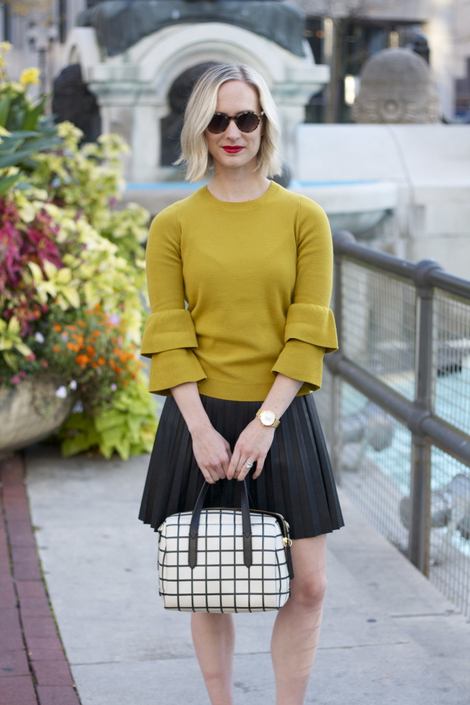 chartreuse bell sleeve sweater, leather skirt, cap toe gemma flats