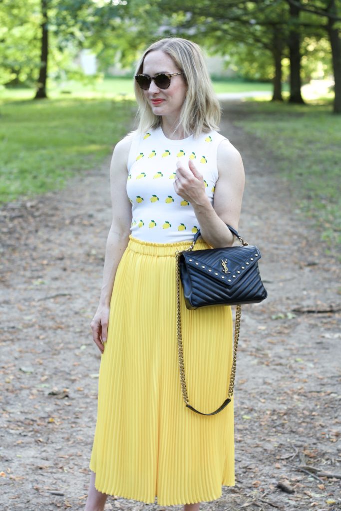 snake sandals, yellow pleated maxi skirt, lemon print stop, YSL college bag medium