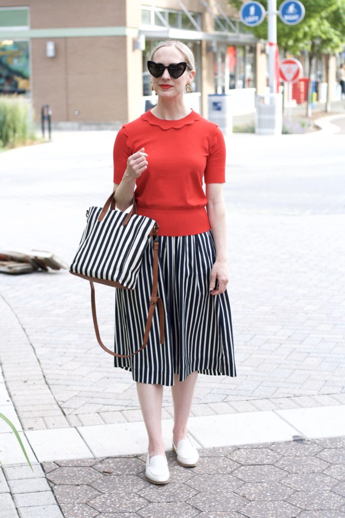 YSL heart sunglasses, striped bag, striped midi skirt
