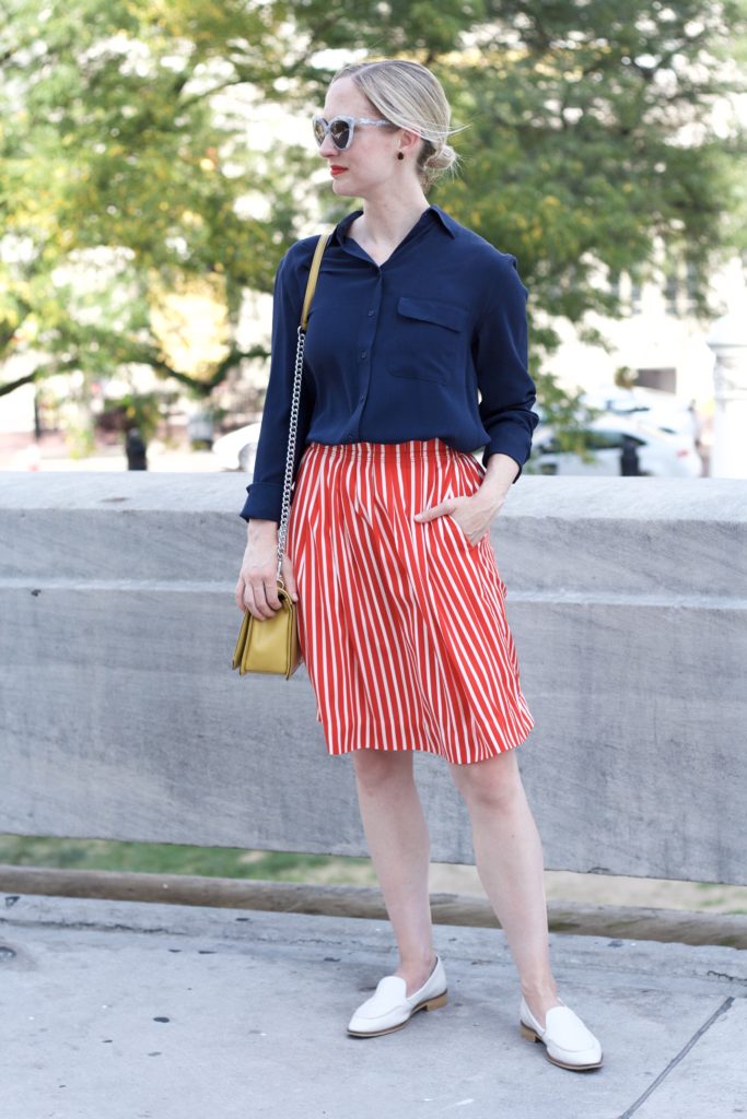 silk blouse, striped skirt, Everlane loafers, mustard bag, Balenciaga sunglasses