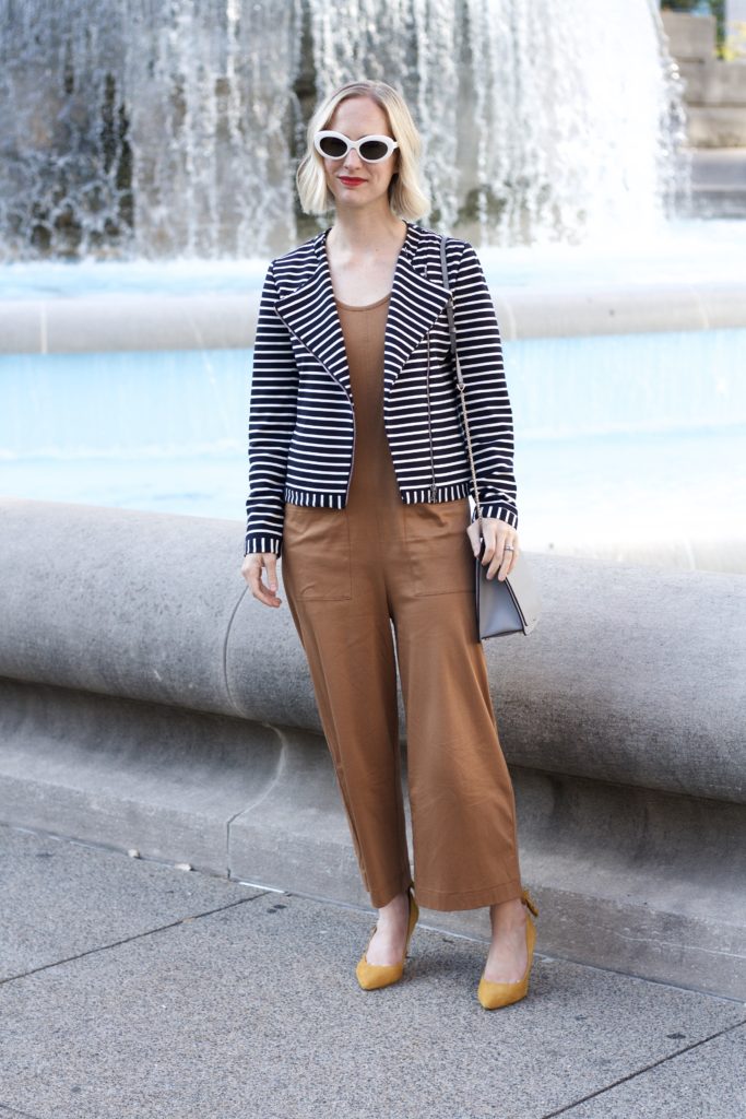 Everlane jumpsuit, stripe moto jacket, Furla crossbody bag, Raen retro white sunglasses