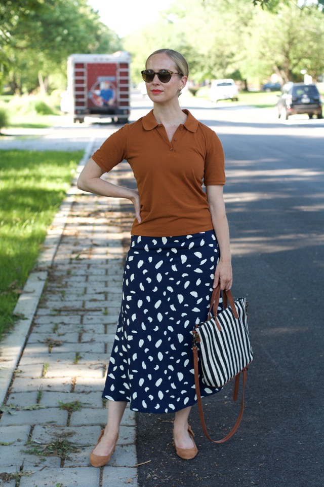 navy midi skirt, brown polo, sustainable face mask