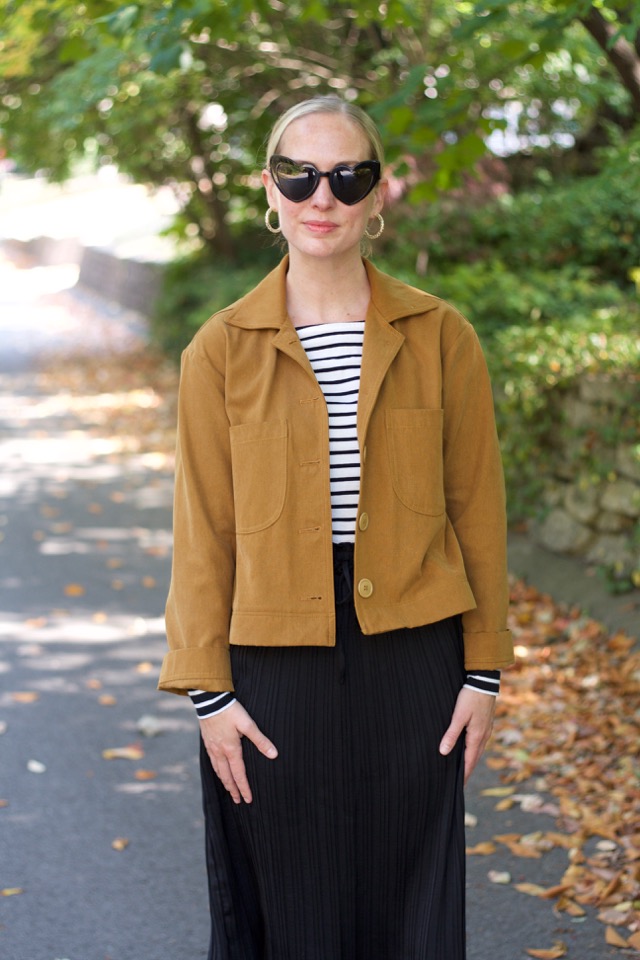 sezane studded booties, flat boots, black midi skirt, ysl heart sunglasses