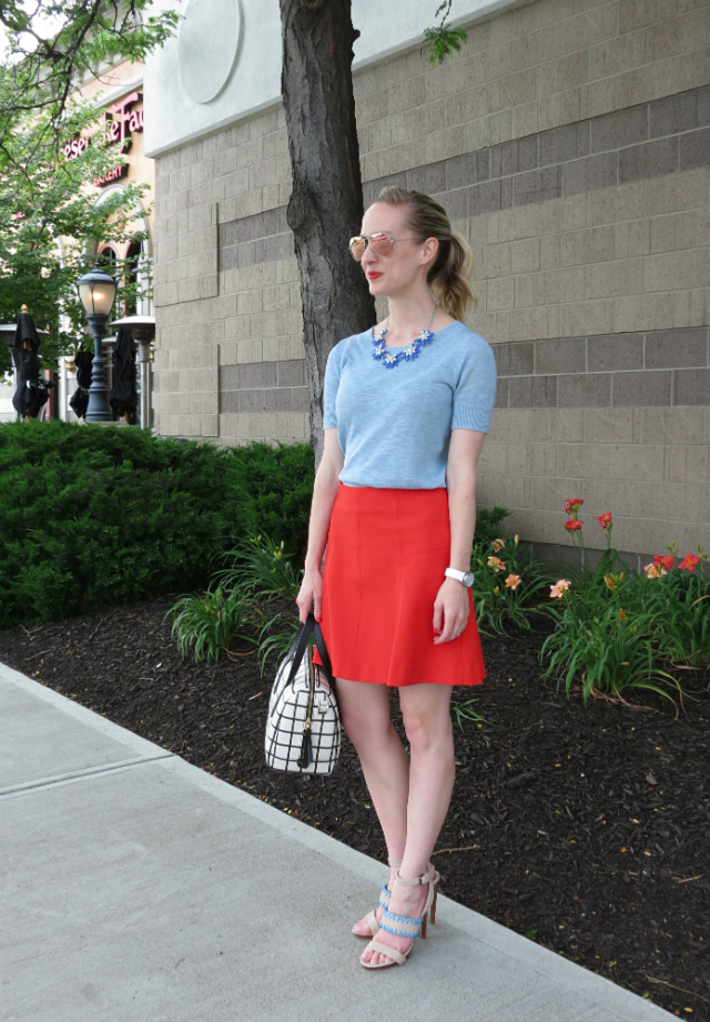 pale blue sweater, red flared skirt, windowpane bag, pink Ray Ban aviators, nude sandals