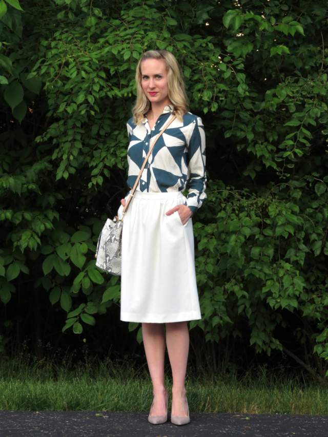 Loft green triangle print blouse, white midi skirt, snake print bucket bag, gray suede pumps