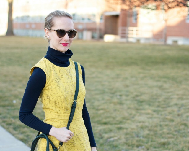 turtleneck layered under dress, gold flats