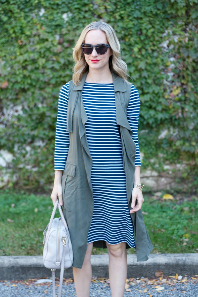 stripe dress, long line olive vest, olive ankle boots, gray Fossil bag