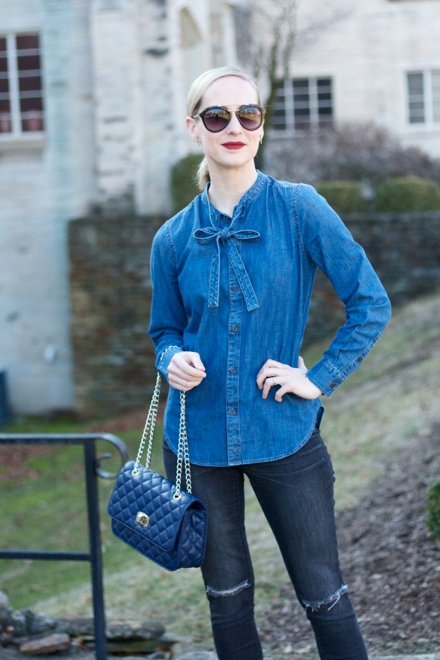 chambray bow shirt, distressed black jeans, white Converse, quilted handbag