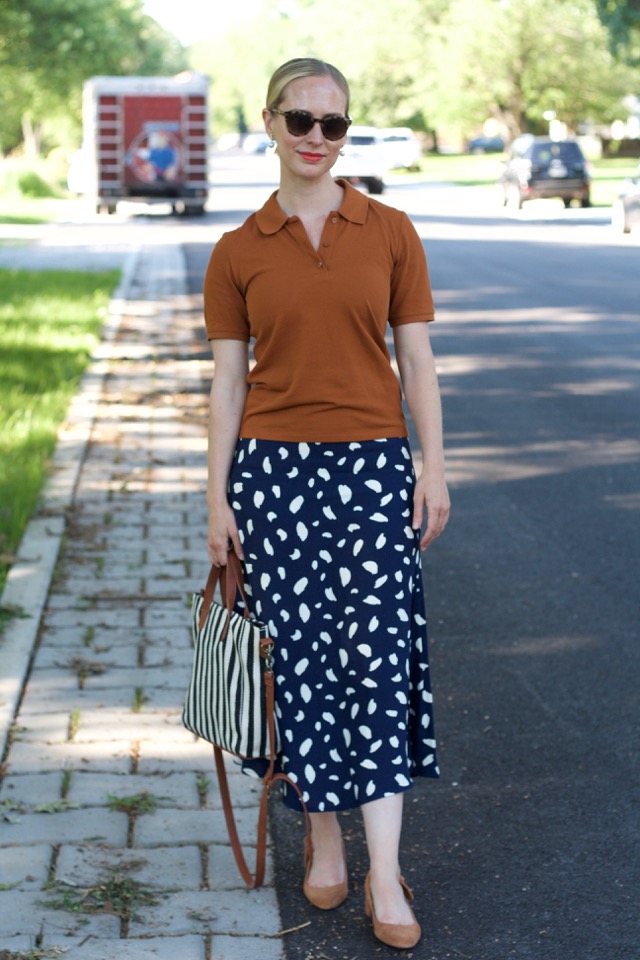 navy midi skirt, brown polo, sustainable face mask